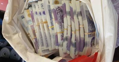 Carrier bag with £20,000 inside found on shelf during early morning raid - www.manchestereveningnews.co.uk