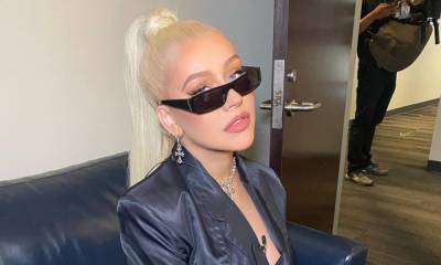 Christina Aguilera's silky all-black ensemble has fans feeling the heat - hellomagazine.com
