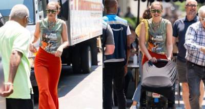 Gigi Hadid rocks orange bell bottoms during a New York outing with baby Khai amid her open letter to paparazzi - www.pinkvilla.com - New York