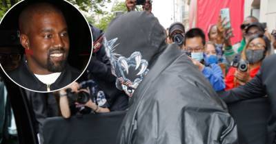 Kanye West Attends Balenciaga Fashion Show in Full Face Covering, Yeezy x Gap Coat - www.usmagazine.com - Paris