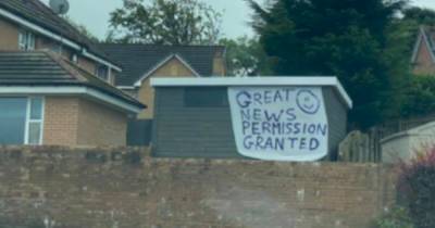 Cheeky Scot hits back at 'petty' neighbours with banner after planning feud - www.dailyrecord.co.uk - Scotland