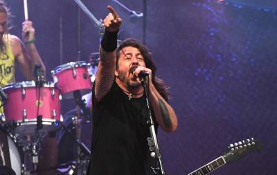 Dave Grohl recalls flying from Australia to LA mid-tour to take his daughters to a dance - www.nme.com - Australia