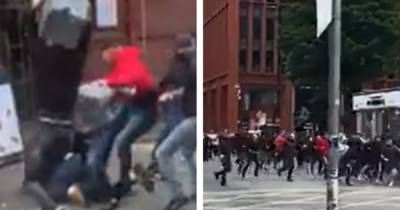 Six arrests after violent city centre clashes between Leeds and Manchester United fans as families forced to 'hide for cover' - www.manchestereveningnews.co.uk - Manchester