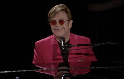Watch Elton John surprise restaurant with performance of Dua Lipa collab - www.nme.com