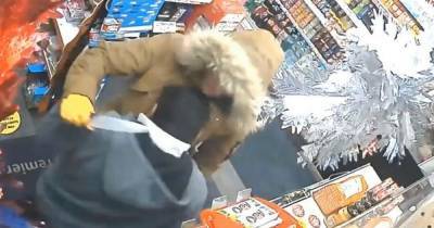 Footage shows fearless shopkeeper fight off knife-wielding thief with wine bottle - www.manchestereveningnews.co.uk