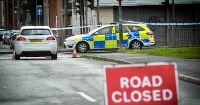 Elderly woman was killed when two-car smash caused traffic light pole to hit her on head, coroner says - www.manchestereveningnews.co.uk - Manchester