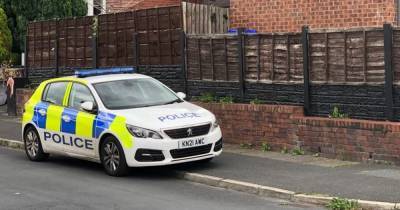 Neighbours' fear as armed police seen 'chasing two men' in incident in Ashton - www.manchestereveningnews.co.uk
