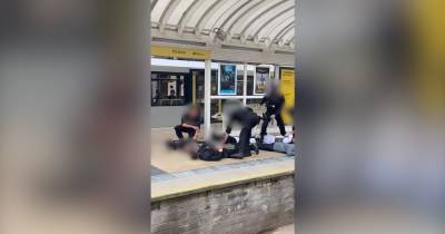 Dramatic moment armed police pin group of lads to Victoria Station floor amid reports of gunman - www.manchestereveningnews.co.uk