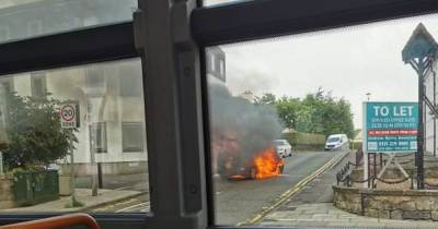Car bursts into flames in middle of Scots road as fire crews race to scene - www.dailyrecord.co.uk - Scotland