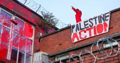 Protesters storm into factory, cover it in red paint and smash up windows - www.manchestereveningnews.co.uk - Manchester - Israel - Palestine