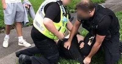 Disturbing video shows police officer kneeling on boy's neck after they had reports of people smoking cannabis - www.manchestereveningnews.co.uk - Manchester