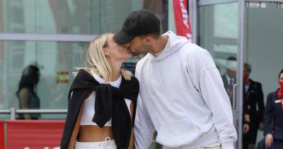 They're back! Love Island winners Millie and Liam put on loved-up display after landing in the UK - www.ok.co.uk - Britain - Spain
