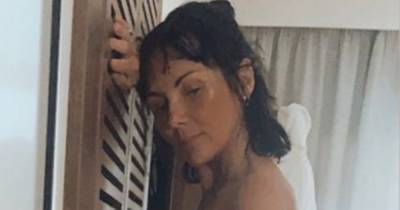 Martine McCutcheon goes topless in bikini snap as she pines for another holiday - www.ok.co.uk - Spain