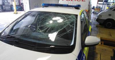 Police cars had tyres slashed and windscreens broken as officers arrive to stop illegal event - www.manchestereveningnews.co.uk - city Charlestown