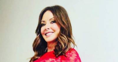 Carol Vorderman poses up a storm as she shows off curves in risqué red lace dress - www.ok.co.uk