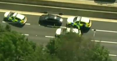 Moment police surround car on M60 due to 'poor standard of driving' - www.manchestereveningnews.co.uk
