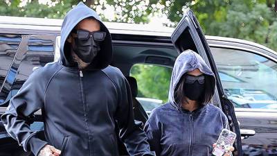 Kourtney Kardashian Travis Barker Twin In Black Hoodies Pants As They Arrive In NYC With Kim - hollywoodlife.com