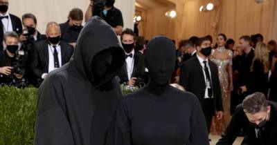 Kim Kardashian dons edgy black bodysuit with face covering as she shows up to Met Gala with mystery man - www.ok.co.uk