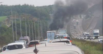 Huge M62 vehicle fire billows smoke into air leading to six miles of tailbacks - www.manchestereveningnews.co.uk