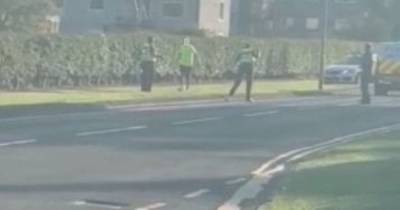 Moment police mow down 'weapon-wielding' man in street after dramatic stand off - www.dailyrecord.co.uk
