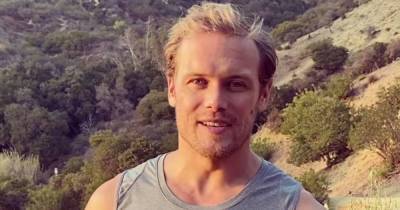 Outlander star Sam Heughan shows off muscles as he challenges fans to charity hillwalk - www.dailyrecord.co.uk - Britain