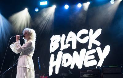 Watch Black Honey join IDLES on stage for fierce set at the Eden Project - www.nme.com