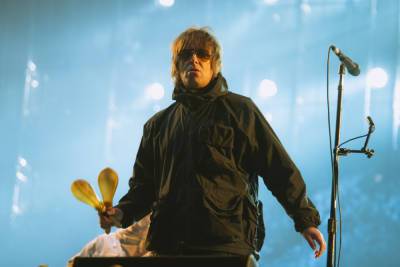 Liam Gallagher reveals injuries after he “fell out of a helicopter” following Isle of Wight set - www.nme.com - county Isle Of Wight