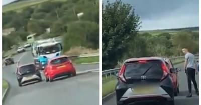 Road rage driver tailgates car before slamming on brakes and confronting motorist inside - www.manchestereveningnews.co.uk