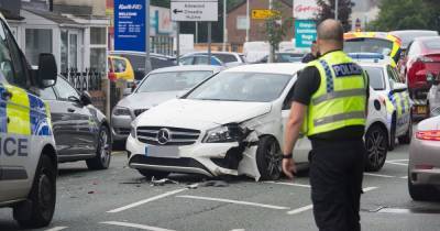Police at scene after Mercedes appears to have crashed into two parked cars - www.manchestereveningnews.co.uk