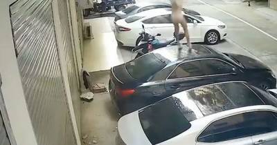 Moment half-naked woman falls from balcony onto car after 'steamy' moment with boyfriend caught on CCTV - www.dailyrecord.co.uk - Taiwan - city Taipei, Taiwan