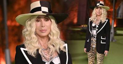 Cher, 75, dons blonde wig, leopard print trousers and a straw hat - www.msn.com