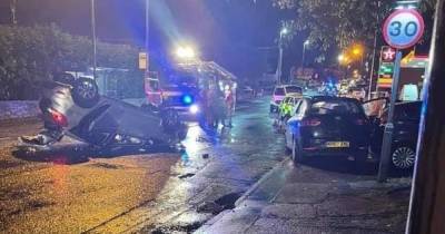 Car flips on its roof in horror crash as firefighters rush to the scene - www.manchestereveningnews.co.uk
