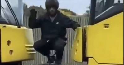 'Tram surfer' waves at passing cars as he risks his life to ride between Metrolink carriages - www.manchestereveningnews.co.uk - city Rochdale