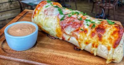 Manchester restaurant creates pizza burrito and it looks like carb heaven - www.manchestereveningnews.co.uk - Britain - USA - Chicago - Manchester