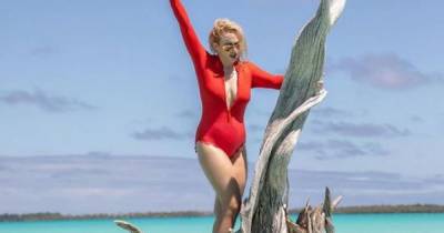 Rebel Wilson shows off five stone weight loss in red swimsuit snap from getaway - www.ok.co.uk