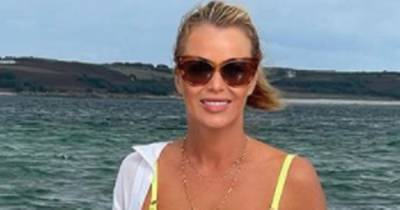 Amanda Holden, 50, wows fans in tiny yellow bikini as they say she should be next 'Bond girl' - www.ok.co.uk - Britain