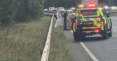 Bride hitches lift to wedding in police car after getting stranded on roadside - www.manchestereveningnews.co.uk