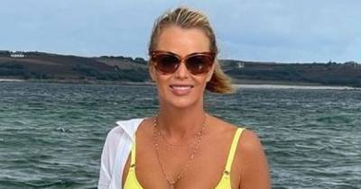 Amanda Holden stuns fans in yellow bikini in 'Bond girl' snap - www.manchestereveningnews.co.uk - Britain - Greece