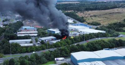 Firefighters battle large blaze at Scots industrial estate as huge smoke plume seen in area - www.dailyrecord.co.uk - Scotland