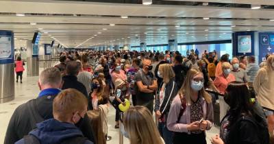 Travel chaos hits Manchester Airport's new billion pound terminal with luggage spilling onto floors and huge queues - www.dailyrecord.co.uk - Manchester