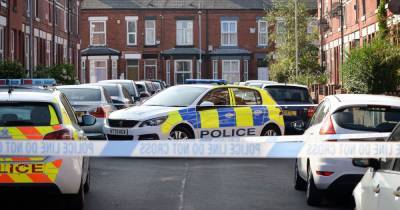 Police tape off Manchester street after 'masked men burst into a house' - www.manchestereveningnews.co.uk - Manchester
