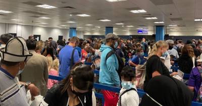 Elderly passenger faints as huge queues continue at Manchester Airport - www.manchestereveningnews.co.uk - Britain - Manchester