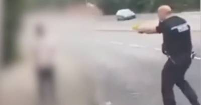 Dramatic footage shows cops stun gun man as officer left seriously injured after tackling man with baseball bat - www.dailyrecord.co.uk - Scotland
