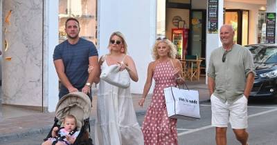 Danielle Armstrong is radiant in white on designer shopping spree during luxury holiday - www.ok.co.uk - Spain