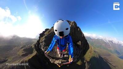 Video shows moment a team BASE jump from Scafell Pike - www.manchestereveningnews.co.uk - Britain