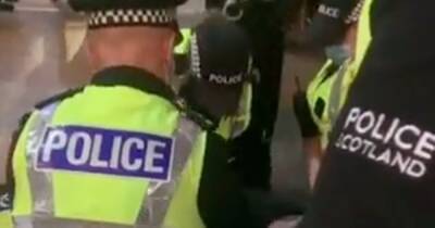 'Rammy' at Scots pub caught on video as cops arrest revellers minutes before Hogmanay bells - www.dailyrecord.co.uk - Scotland
