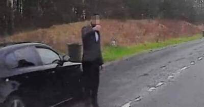 Sinister black BMW driver scamming motorists for cash at side of Scots roads - www.dailyrecord.co.uk - Scotland - city Columbia