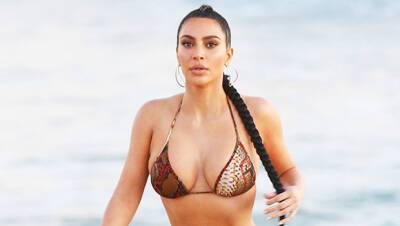 Kim Kardashian - Kim Kardashian Sizzles In Sexy Black Bikini Bottoms A SKIMS Top On The Beach — Photos - hollywoodlife.com