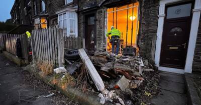 Car which ploughed into house leaving trail of wreckage was being chased after failing to stop for police - www.manchestereveningnews.co.uk - Manchester