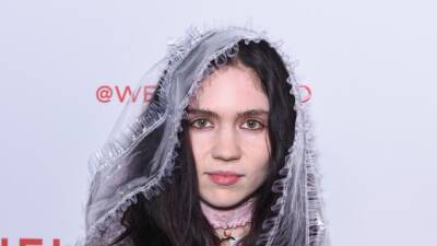 Grimes Shows Off New Ink, Says She Plans to Have a 'Full Alien Body' Covered in Tattoos - www.etonline.com - Texas